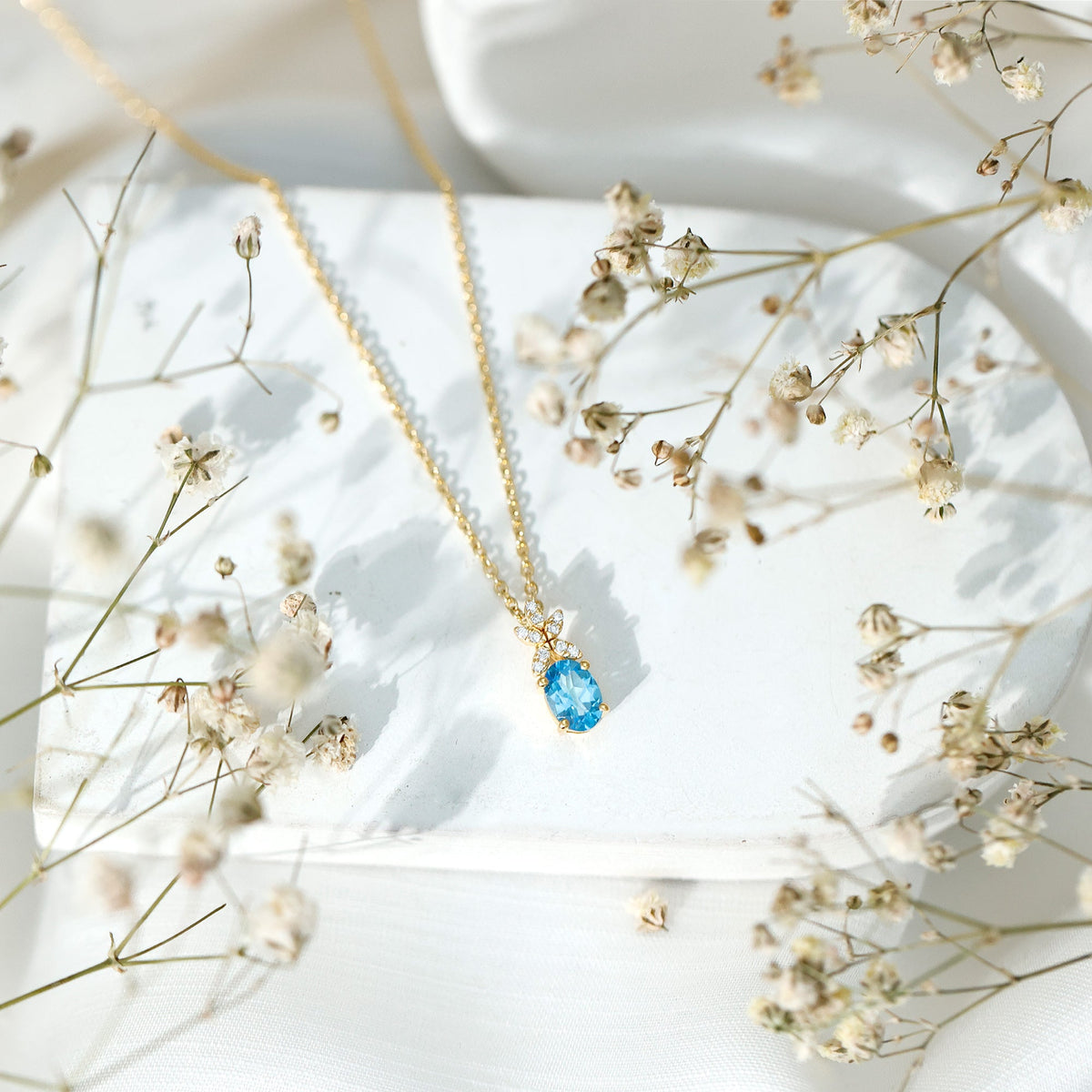 Oval Cut 0.65 Carat Swiss Blue Topaz and Diamond Flower Necklace with Chain