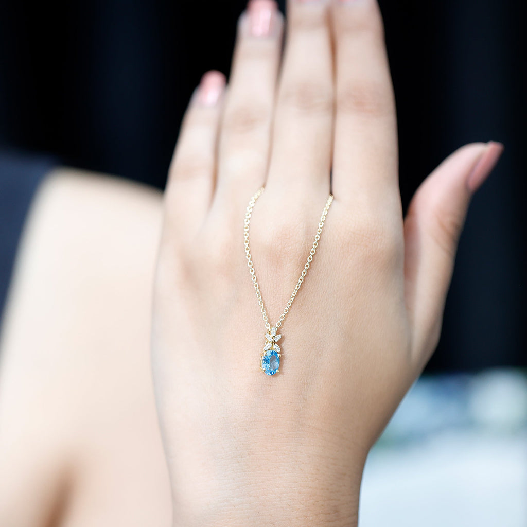 Oval Cut 0.65 Carat Swiss Blue Topaz and Diamond Flower Necklace with Chain